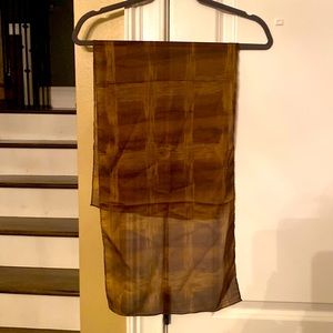 Lightweight, gauzy scarf and brown tones. Excellent condition.